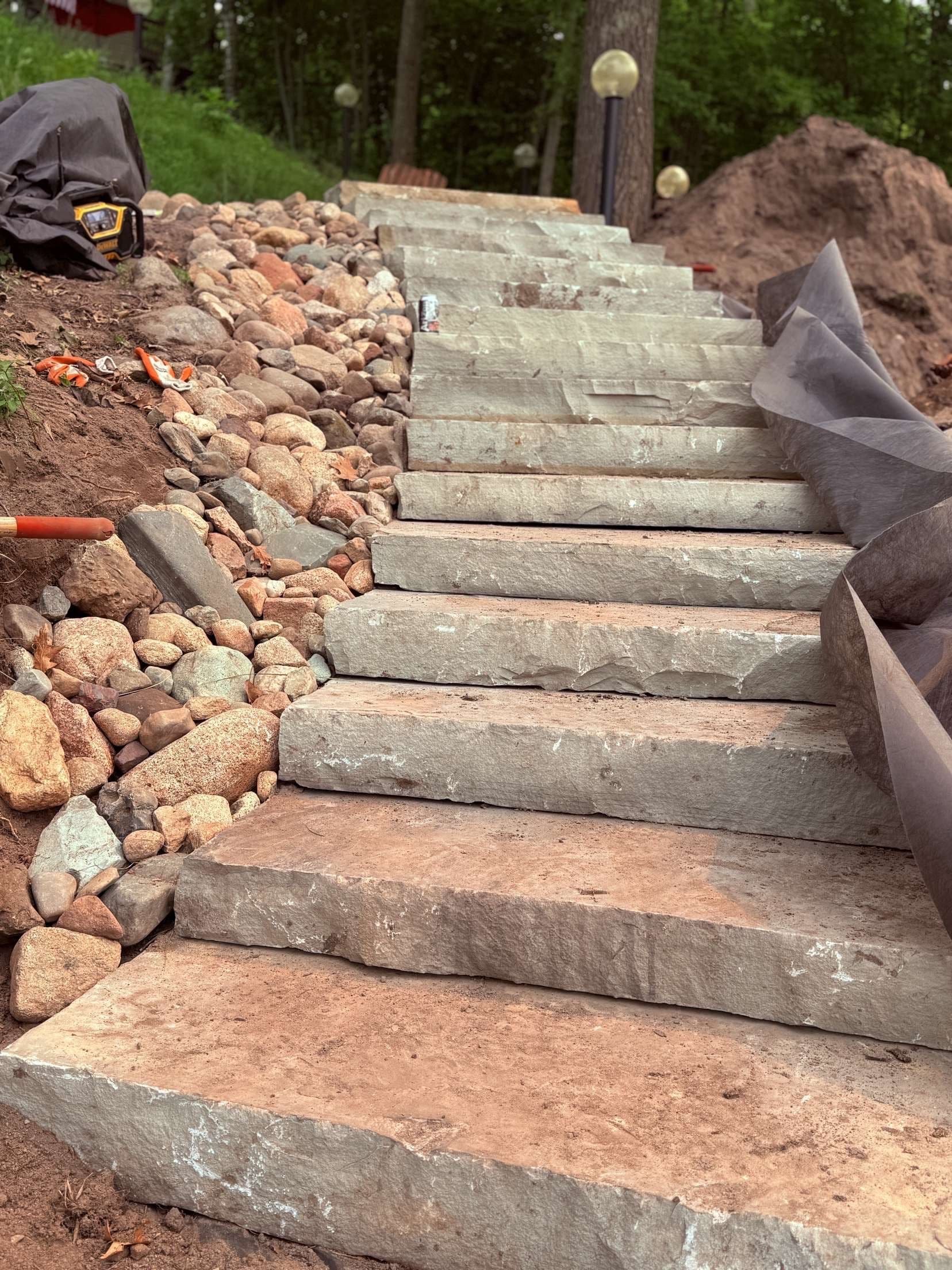 Strong Stone Steps and Boulder Walls Near the Water at Tectonic Outdoors image
